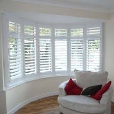 To achieve a modern look at a bay window, hang tab top curtains with draping along the top. 10 Fair Cool Ideas Fabric Blinds Cornice Boards Livingroom Blinds And Curtains Bedroom Blinds Green Be Living Room Blinds Bay Window Blinds Blinds For Windows
