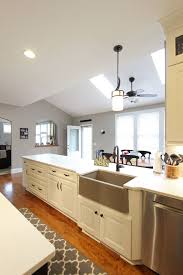 25+ ways to style grey kitchen cabinets august 1, 2019. White Kitchen With Espresso Island And Eternia Caringdale Quartz Countertop Transitional Kitchen Cleveland By Cabinet S Top Houzz