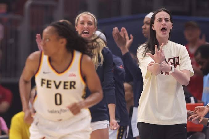 Caitlin Clark may be out with injury but she's plenty active on sidelines
