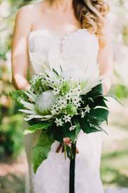 Wedding styles come and go, but white never goes out of style: 20 Tropical Leaf Wedding Bouquets Tropical Wedding Bouquets Orchid Bouquet Wedding Wedding