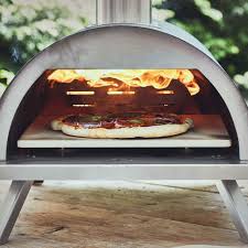 Un four en plein air. Burnhard Nero Outdoor Pizza Oven Stainless Steel Including Pizza Spatula And Pizza Stone High Quality Pizza Oven Premium Wood Stove Suitable For The Garden And Outdoors Pellets Coal And Briquettes Amazon De Garten