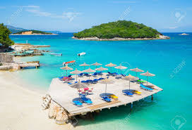 The islands are remote and can only be accessed by boat. Sunshade Umbrellas And Deckchairs On The Beautiful Ksamil Beach Stock Photo Picture And Royalty Free Image Image 65604079