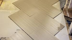 My tiler is starting to lay my tile in a 70/30 split. Bathroom Renovation 12x24 Bathroom Tile Pattern Options