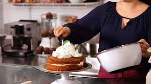 Use a medium consistency icing and position the bag at a 90 degree angle. How To Ice A Cake With Whipped Cream Cake Decorating Youtube