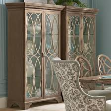 Find the perfect decorative accents at hayneedle, where you can buy online while you explore our room designs and curated looks for tips, ideas & inspiration to help you along the way. Trisha Yearwood Home Collection By Klaussner Jasper County Melinda China Cabinet With Ornate Tracery And Display Lighting Furniture Mart Colorado China Cabinets