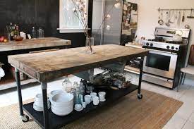 Our talented team will walk you through our stylish & unique kitchen showroom. Kitchen Island In Industrial Style Metal Base Is Mounted Industrial Kitchen Island Rustic Kitchen Kitchen Remodel
