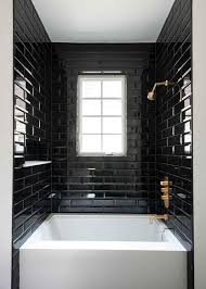 In this bathroom built by mcnaughton brothers construction and designed by kate marker interiors, the brass on the mirror and light. Black Subway Tile Bathrooms Novocom Top