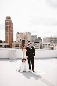 Detroit Mesonic Temple Wedding Bride And Groom On Top Of Belt Z Lot Detro Grand Rapids Wedding Grand Rapids Wedding Photographer Detroit Wedding Photographer
