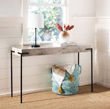 Sleek and contemporary, the wolcott console table makes for a grand entrance in the front hall and a dramatic statement in any room. Safavieh Home Eli Industrial Light Grey And Black Console Table Buy Online In Saint Lucia At Saintlucia Desertcart Com Productid 161252583