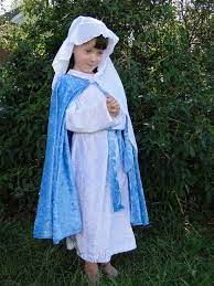 A Child In A Mother Mary Costume Mary Costume Saint Costume All Saints Day