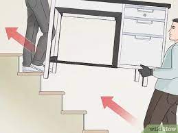 Gripping the handles firmly, tilt the hand truck toward you to balance the weight on the wheels. 4 Simple Ways To Move Heavy Furniture Upstairs Wikihow