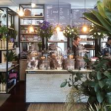 A Cozy Cafe Is Pretty Much The Ultimate Happy Place Whether You Re People Watching Catching Up With Frie Coffee Shop Decor Flower Shop Decor Cute Coffee Shop