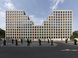 It stands for wicked evil grin or wide evil grin. Hotel And Office Building Werdauer Weg Max Dudler Archdaily