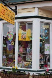 Just For Laughs Is Displaying Lots Of Spring Colors In Their Window Spring Colors Wet Cat Food Spring Shopping