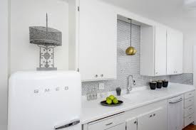 To go contemporary, pair your white cabinets with black hardware. 15 Modern White Kitchens