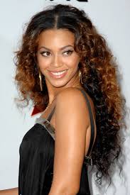 We love how in this look she added bangs with beads to really frame the face with hair. 48 Beyonce Hairstyles Through The Years