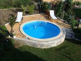 Round Steel Wall Pool With Light Curbs And Wooden Edging Backyard Patio Designs With Pool Hellen Backyard Upgrades Pool House Decor Backyard Pool