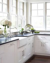 Maybe you would like to learn more about one of these? Kitchen White Shaker Cabinets Absolute Black Granite Counters White Farmhouse Sink Lots Of Windows White Farmhouse Sink Kitchen Remodel Kitchen Renovation