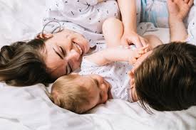 Free Photo Young Couple With Baby In The Morning