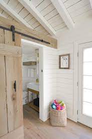 Barn Door In A White Cottage Rustic Barn Door Cottage Bathroom White Cottage