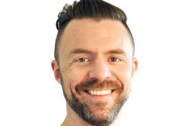 Custom concrete paving enables clubhouse to blend with foreshore setting