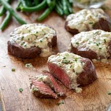 Beef tenderloin is a large and versatile cut of meat that comes from the back of a cow. Beef Tenderloin Steaks With Blue Cheese Topping