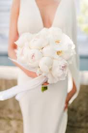 Few flower types can claim the kind of excitement that peonies garner from couples, wedding florists, designers and planners alike. Minimal Bridal Bouquet Arabia Weddings