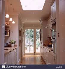 pendant lights above worktop in white
