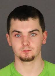 Yale man charged with firing shotgun at another man's home