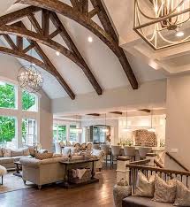 Talk About Drama In A Design Love How The Wood Beams Bring In Warmth Into This B Vaulted Ceiling Living Room Farm House Living Room French Country Living Room