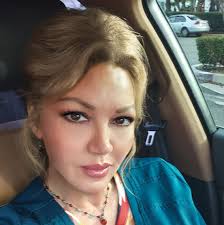 A large wave overcame Nikki Lewis and slammed her headfirst into the sand,  breaking her neck and partially paralyzing her.