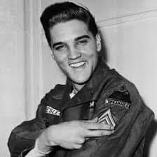 Elvis Presley receiving a police badge