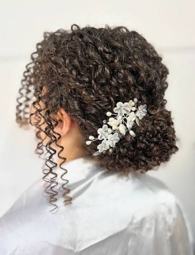 The Curly Low Bun✨ My take on the curly low curly bun on a variety of  colours and textures✨ Brides- save for inspo✨ The low curly bun will be  taught in the