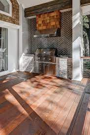 An Outdoor Space Perfect For Gathering Or Relaxing The Backsplash Surrounding The Outdoor Grill Outdoor Bbq Kitchen Outdoor Kitchen Decor Outdoor Grill Area