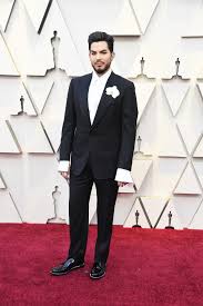 Oscars 2019 Adam Lambert Rocks A Giant Orchid On The Red Carpet Billboard