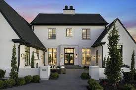 The cianna plan is a wonderful modern farmhouse style plan with stunning curb appeal. White Stucco Homes Stunning 2 Story White Stucco Modern Home Accented With A Gray Shingled Roof Modern Farmhouse Exterior House Paint Exterior Modern Exterior