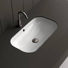 On the other hand, as their name suggests, undermount sinks are inset into the cabinet below, and end up sitting slightly lower. Pros And Cons Of Undermount Bathroom Sinks