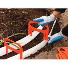 Make a mold for your concrete curb with wooden or plywood boards. Pour Your Own Concrete Mold Great Idea To Use On Our Patio This Summer Concrete Landscape Edging Landscape Edging Lawn And Garden