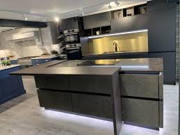 Fireclay sinks are simply pretty with the color and reflective sheen of ceramic. Beautiful Ex Display Bauformat Berlin Black Silky Matt Gold Stone Veneer Handleless Kitchen Island Bosch Appliances Caeserstone Woodlands Worktops Oak Tabaco Breakfast Bar