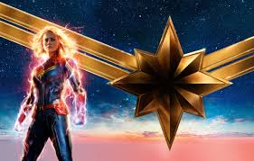Captain marvel is an extraterrestrial kree warrior who finds herself caught in the middle of an intergalactic battle between her people and the skrulls. Wallpaper The Sky Girl Background Fiction Stars Blonde Costume Poster Comic Marvel Carol Danvers Captain Marvel Captain Marvel Brie Larson Brie Larson Images For Desktop Section Filmy Download