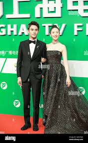 FILE--Chinese actor Wang Kai, left, and --FILE--Chinese actress Tong Yao,  right, show up at the 25th Shanghai TV Festival Magnolia Awards. Shanghai  Stock Photo - Alamy