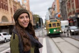 Happy Woman Waiting For Melbourne Tram Austockphoto Happy Women Melbourne Tram Women