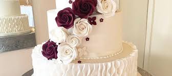 Photography34 thank you so much for sharing these utterly beautiful images with us. Ivory Wedding Cake With Ruffles And Burgundy Flowers The Cakery Leamington Spa