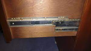 You should hear a small click as the drawer runners disengage from the cabinet runners on both sides. How To Remove Drawer On Old Accuride Rails Home Improvement Stack Exchange