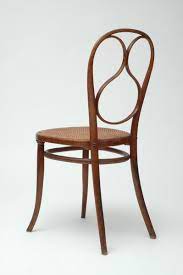 Most of the chair seats are rush or canned and the bent wood supports the back and legs of the chair in gentle curved styles. Thonet 14 Bistro Chair A Purposeful Process Bistro Chairs Purple Dining Chairs Thonet Chair