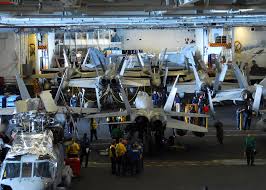 The Hangar Bay Aboard The Aircraft Carrier Uss Ronald Reagan Cvn 76 Aircraft Carrier Navy Carriers Flight Deck