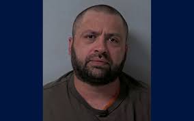 Burnside arrested after climbing into apartment from balcony