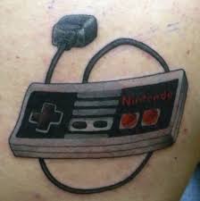 For example, a great choice would be a slice of pizza so you always have a 'pizza' each other nearby! Nintendo Contoller Tattoo By Stretch Tattoonow