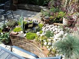 This shows how to build a raised pond above ground with wood. Ponds West Sussex Garden Design Landscaping And Contracting