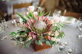 Pin By Janine O Hagan On Rustic Romance Protea Wedding Flower Decorations Tropical Wedding Flowers